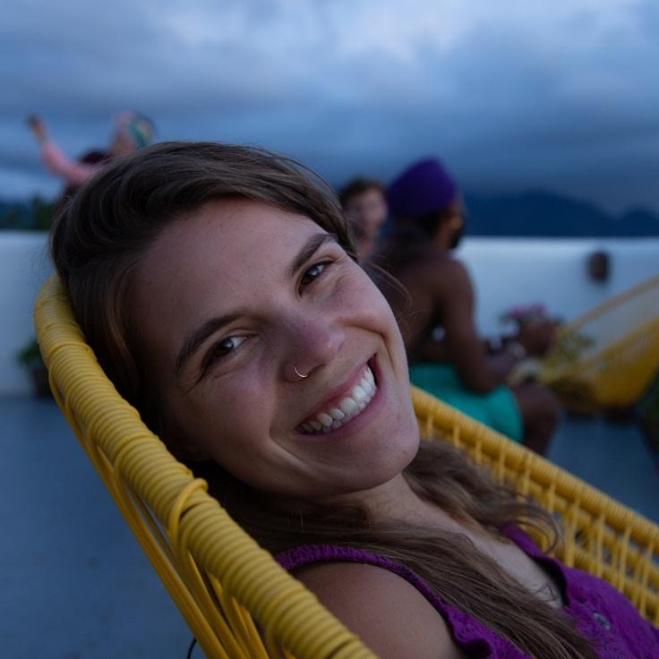 Avery Chen, Lead Design Curator at Harbor Meadow Plain, reviewing corporate floral arrangements
